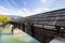 A weathered pedestrian bridge crossing a river in Innsbruck