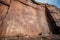 weathered petroglyphs on a cliff face