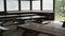 Weathered Picnic Tables in Sheltered Campsite Setting