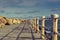 Weathered railings and seafront promenade