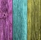 Weathered rainbow colored wooden plank background. Texture with copy space