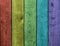 Weathered rainbow colored wooden plank background. Texture with copy space