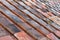 Weathered red roof tiling background texture