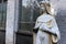 Weathered religious marble Virgin Mary statue in church cemetery graveyard memorial