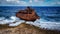 Weathered rusty Caribbean shipwreck on the shore of a Little Curacao Island