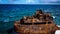 Weathered rusty Caribbean shipwreck on the shore of a Little Curacao Island