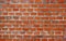 Weathered stained old brick wall background.