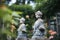 weathered statues in manors overgrown garden