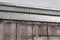 Weathered wall and steel roof of an old industrial warehouse