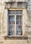 Weathered Window in a Limestone Wall