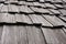 Weathered wood roof shingles perspective closeup horizontal background