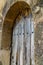 Weathered wooden door with rustic wood grain - angled view