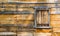 Weathered wooden wall with shuttered window on colonial barn