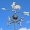Weathervane with rooster above an arrow
