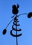 Weathervane in the shape of a bird with spiral