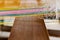 Weaving colorful cotton threads by tradtional wooden loom