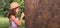 Web banner of children& x27;s education and curiosity. Cute little girl in a straw hat looks at the tree bark through a