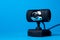 Webcam on a blue background. Remote communication.