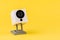 webcam white on a yellow background, object, Internet, technology concept