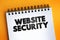 Website Security text quote on notepad, concept background