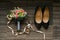 Wedding accessories of the bride: shoes, bouquet of roses and eucalyptus