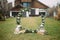 Wedding arch is on a background of lawn and a house