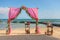 Wedding arch on the beach and a tropical beach.