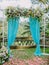 Wedding Arch with beautiful flowers, petals and blue cloth. Wedding ceremony in Bali