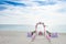 Wedding arch decorated with flowers on tropical beach, outd