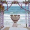 Wedding arch decorated with flowers on tropical sand beach, outdoor beach wedding setup