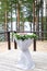 Wedding arch and grey chairs with peonies standing in ceremony a