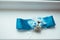 Wedding background with blue bridal garter on the