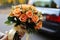 Wedding bliss Bride displays a bright bouquet of orange roses