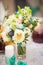 Wedding bouquet beige turquoise flowers in a transparent vase