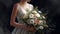 wedding bouquet in bride s hands. The bouquet consists of white