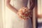 Wedding bouquet at bride\'s hands. studio shot