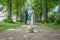 Wedding bouquet on foreground of a blurred kissing couple. Flowers and lovers