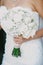 Wedding bouquet in hands of the bride.vintage color