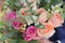 Wedding bouquet of peach roses by David Austin, single-head pink rose aqua, eucalyptus, ruscus, gypsophila