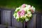 Wedding bouquet on rustic country fence