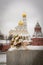 Wedding bouquet on the street on the background of the Orthodox Cathedral with Golden domes of the Moscow Kremlin