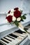 Wedding, bouquet and wedding rings lie on the piano, symbolizing life