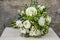 Wedding bouquet with white flowers and green leaves