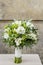 Wedding bouquet with white flowers and green leaves