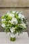 Wedding bouquet with white flowers and green leaves