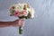 Wedding bouquet on with white roses on gray background in Valentine`s day