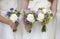 Wedding bouquets held by bridesmaids