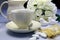 Wedding breakfast dining table setting with fine china coffee cup and milk jug - horizontal.