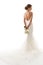 Wedding Bride Back Rear View, Beautiful Woman in White Sexy Dress with Long Tail Train and Flowers Bouquet, Elegant Studio