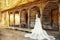 Wedding Bride Dress Rear View Outdoors. Vintage White Bridal Gown over Old Wooden Terrace. Romantic Woman Portrait